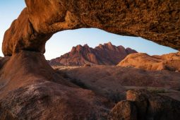 Rock arch and granite mountains at sunset in Spitzkoppe, Damaraland, Namib Desert, Namibia.